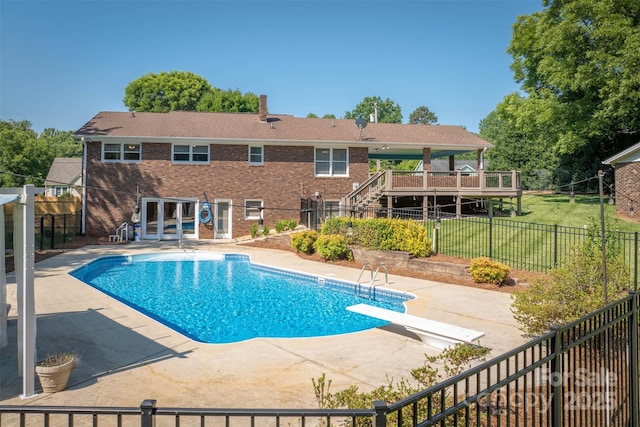 207 Valdese Dr, Morganton, NC 28655 - view of pool with a patio area, a diving board, and a fenced backyard