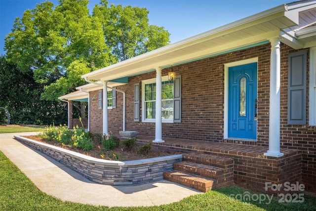 207 Valdese Dr, Morganton, NC 28655 - entrance to property with covered porch and brick siding