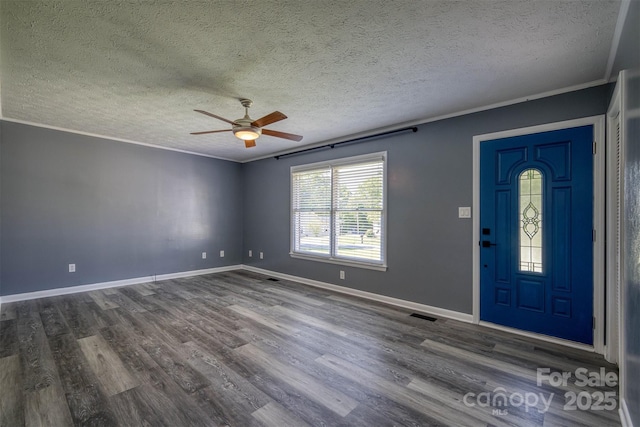 207 Valdese Dr, Morganton, NC 28655 - foyer entrance featuring ceiling fan, wood finished floors, a textured ceiling, and ornamental molding