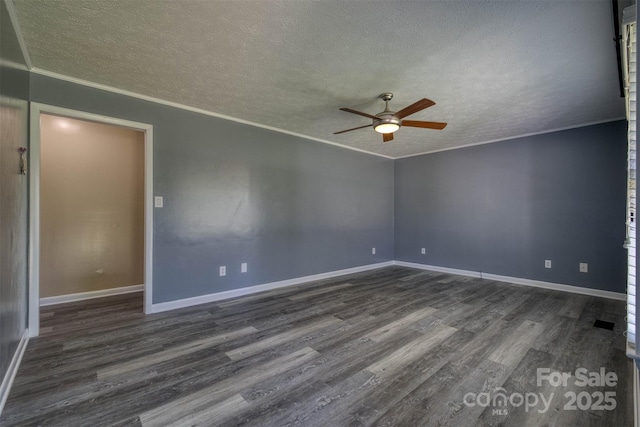 207 Valdese Dr, Morganton, NC 28655 - empty room with a textured ceiling, a ceiling fan, dark wood finished floors, and crown molding