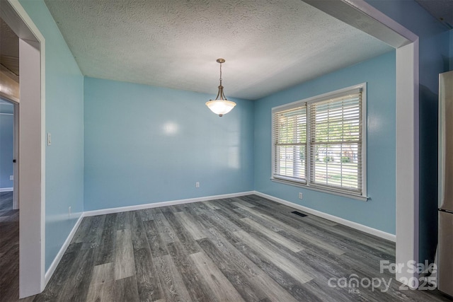 207 Valdese Dr, Morganton, NC 28655 - unfurnished dining area featuring dark wood-style flooring and a textured ceiling