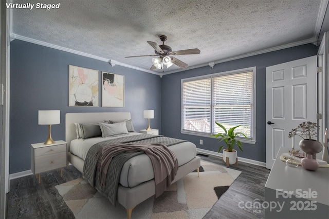 207 Valdese Dr, Morganton, NC 28655 - bedroom featuring ornamental molding, wood finished floors, a textured ceiling, and ceiling fan
