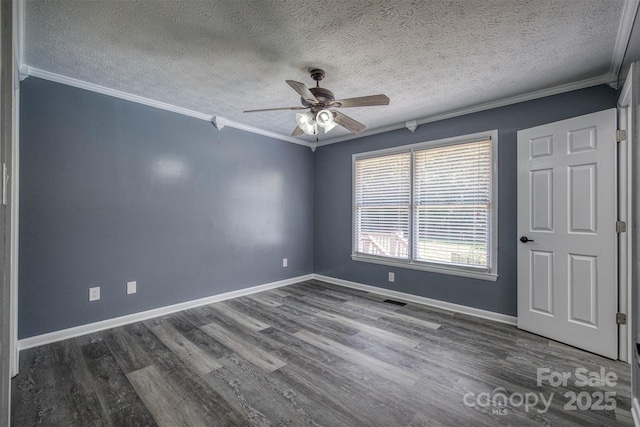 207 Valdese Dr, Morganton, NC 28655 - spare room featuring crown molding, a ceiling fan, dark wood-type flooring, and a textured ceiling