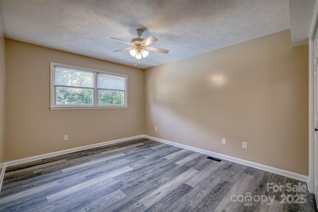 207 Valdese Dr, Morganton, NC 28655 - unfurnished room with ceiling fan, wood finished floors, and a textured ceiling