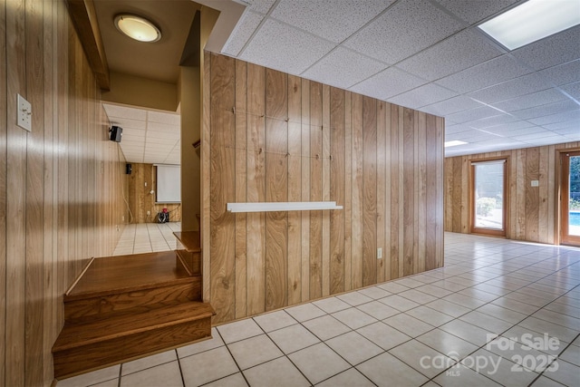 207 Valdese Dr, Morganton, NC 28655 - hallway with wooden walls and tile patterned floors