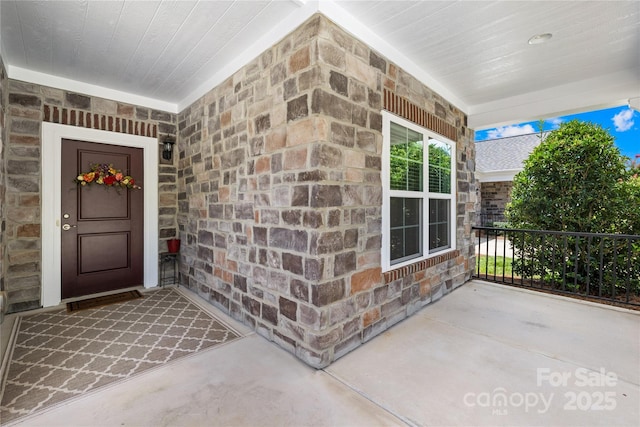 135 Valleymist Ln, Mooresville, NC 28117 - property entrance with a porch and stone siding