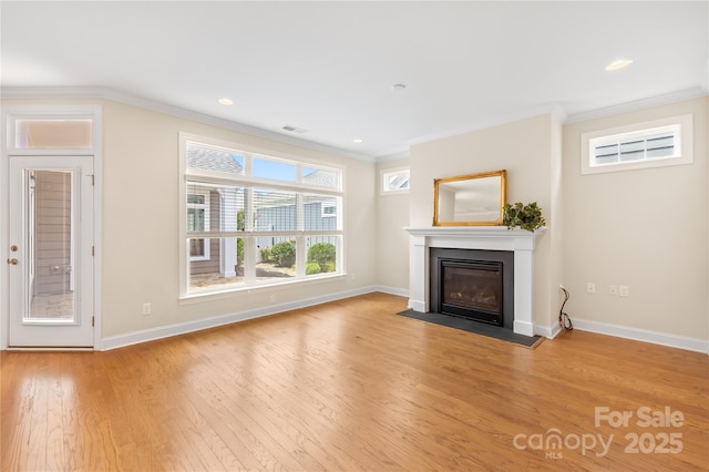 135 Valleymist Ln, Mooresville, NC 28117 - unfurnished living room featuring a fireplace with flush hearth, wood finished floors, and crown molding