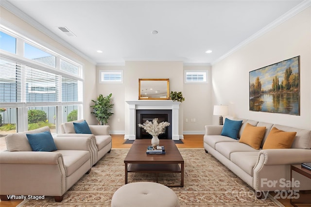 135 Valleymist Ln, Mooresville, NC 28117 - living area featuring crown molding, light wood-style flooring, a fireplace with flush hearth, and recessed lighting
