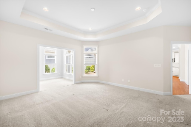 135 Valleymist Ln, Mooresville, NC 28117 - empty room featuring a tray ceiling, carpet, ornamental molding, and recessed lighting