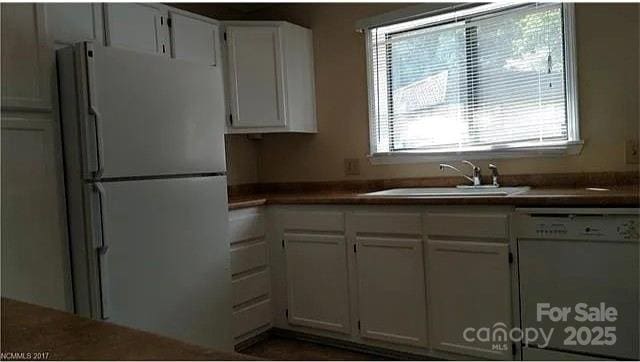 11 Lake Dr Unit B-1, Hendersonville, NC 28739 - kitchen featuring white appliances, white cabinets, and dark countertops