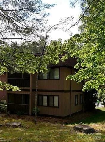 11 Lake Dr Unit B-1, Hendersonville, NC 28739 - view of side of home featuring a lawn