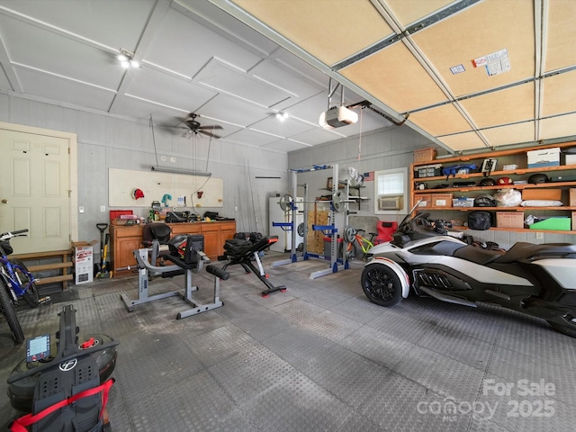 312 Garrison Dr, Albemarle, NC 28001 - garage featuring a garage door opener and a workshop area