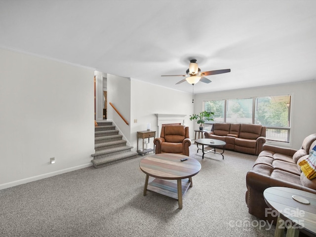 312 Garrison Dr, Albemarle, NC 28001 - carpeted living room with ceiling fan, stairs, and ornamental molding
