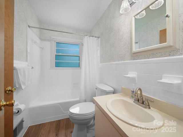 312 Garrison Dr, Albemarle, NC 28001 - full bathroom with shower / bath combination with curtain, wood finished floors, vanity, wallpapered walls, and tile walls
