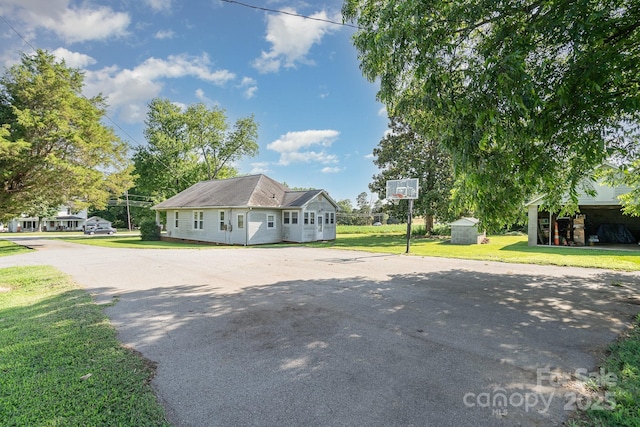 4712 Mooresville Rd, Salisbury, NC 28147 - view of property exterior with a storage shed, a lawn, and driveway