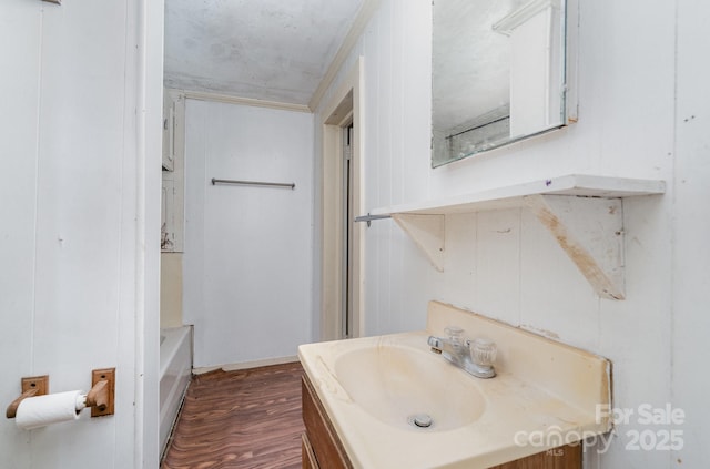 4712 Mooresville Rd, Salisbury, NC 28147 - bathroom with vanity, wood finished floors, and a bathtub