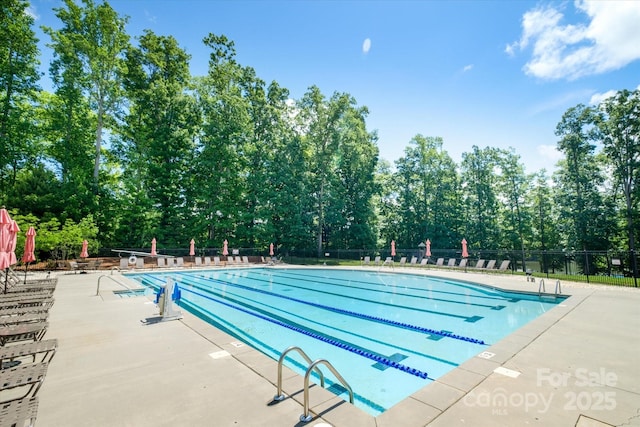 9122 Carneros Creek Rd Unit 25, Charlotte, NC 28214 - community pool with a patio area and view of wooded area