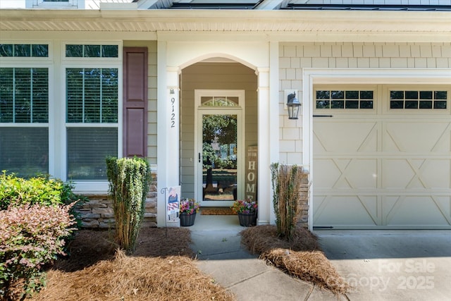 9122 Carneros Creek Rd Unit 25, Charlotte, NC 28214 - doorway to property with covered porch and a garage