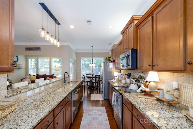 9122 Carneros Creek Rd Unit 25, Charlotte, NC 28214 - kitchen with appliances with stainless steel finishes, brown cabinets, dark wood finished floors, tasteful backsplash, and light stone countertops