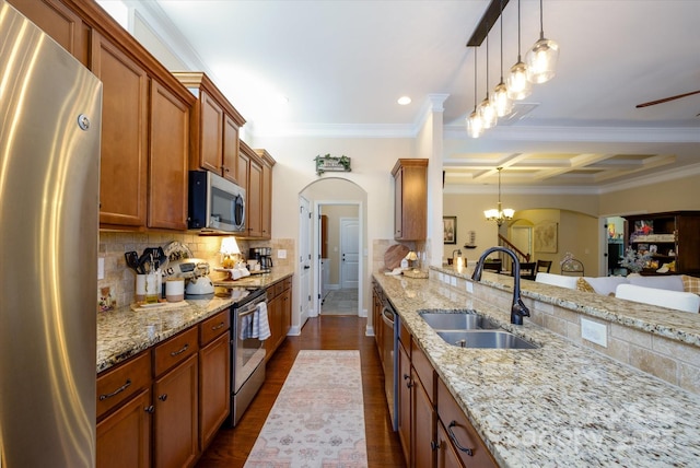 9122 Carneros Creek Rd Unit 25, Charlotte, NC 28214 - kitchen featuring stainless steel appliances, crown molding, coffered ceiling, brown cabinetry, and light stone counters