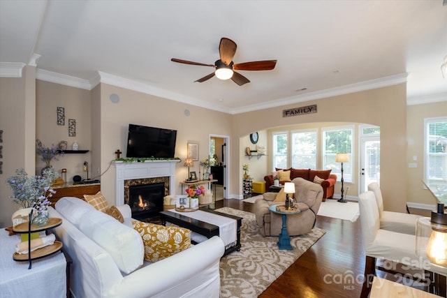 9122 Carneros Creek Rd Unit 25, Charlotte, NC 28214 - living room with wood finished floors, a ceiling fan, crown molding, a high end fireplace, and arched walkways