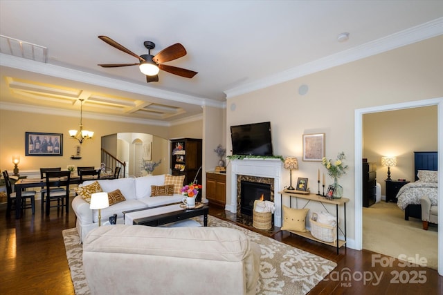 9122 Carneros Creek Rd Unit 25, Charlotte, NC 28214 - living room featuring arched walkways, crown molding, ceiling fan, a high end fireplace, and dark wood-style flooring