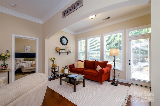 9122 Carneros Creek Rd Unit 25, Charlotte, NC 28214 - living room with healthy amount of natural light, wood finished floors, crown molding, and arched walkways