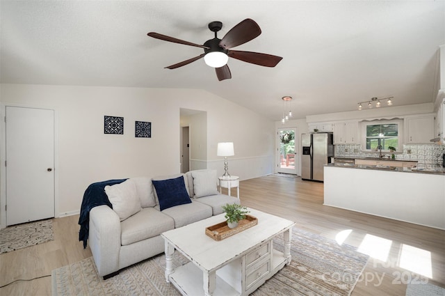 256 Timberland Loop, Mooresville, NC 28115 - living area featuring light wood-style floors, ceiling fan, and lofted ceiling
