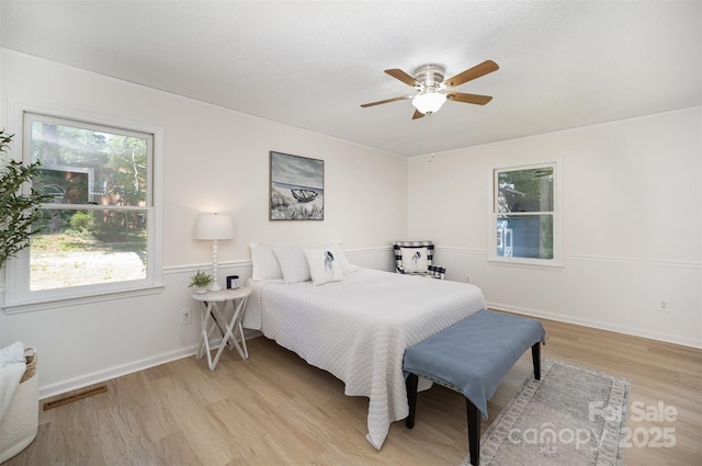 256 Timberland Loop, Mooresville, NC 28115 - bedroom with light wood-style floors and ceiling fan
