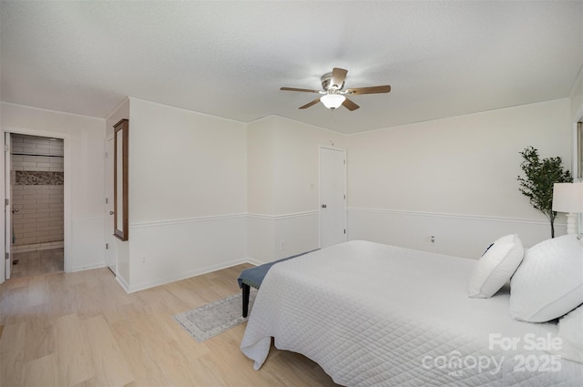 256 Timberland Loop, Mooresville, NC 28115 - bedroom with light wood-type flooring, a ceiling fan, and a textured ceiling