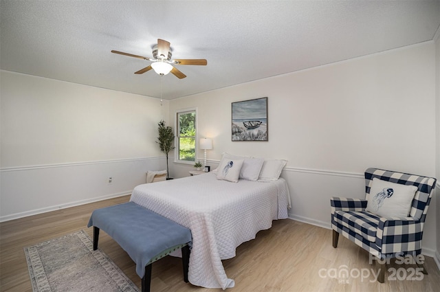 256 Timberland Loop, Mooresville, NC 28115 - bedroom with wood finished floors, ceiling fan, and a textured ceiling