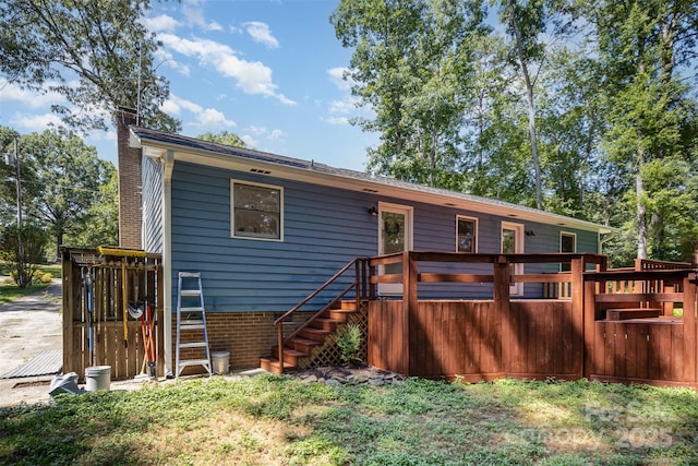 256 Timberland Loop, Mooresville, NC 28115 - back of house featuring a chimney, a deck, and stairs