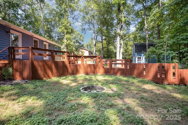 256 Timberland Loop, Mooresville, NC 28115 - fenced backyard featuring an outdoor fire pit and a deck