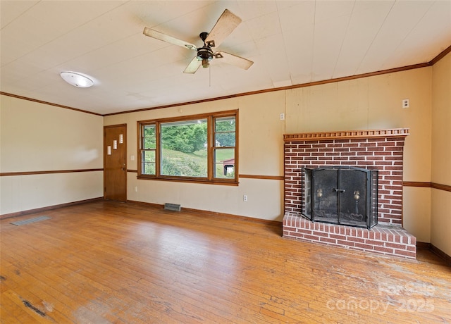 3575 Dellwood Rd, Waynesville, NC 28786 - unfurnished living room with hardwood / wood-style flooring, ornamental molding, ceiling fan, and a fireplace