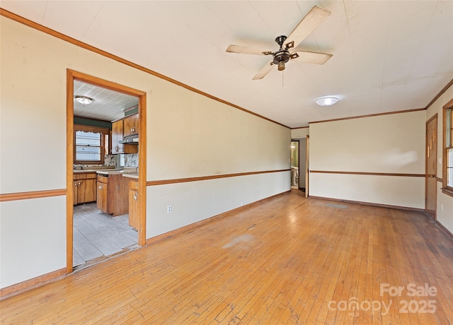 3575 Dellwood Rd, Waynesville, NC 28786 - unfurnished room featuring light wood-style flooring, ornamental molding, and ceiling fan