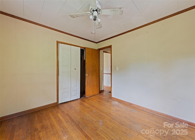 3575 Dellwood Rd, Waynesville, NC 28786 - unfurnished bedroom with hardwood / wood-style floors, ornamental molding, a closet, and ceiling fan
