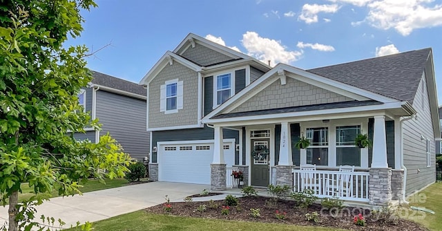 1024 Laggan Ln Unit 255, Indian Trail, NC 28079 - craftsman inspired home featuring a porch, driveway, stone siding, an attached garage, and roof with shingles