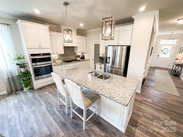 1024 Laggan Ln Unit 255, Indian Trail, NC 28079 - kitchen with appliances with stainless steel finishes, crown molding, an island with sink, dark wood-type flooring, and recessed lighting
