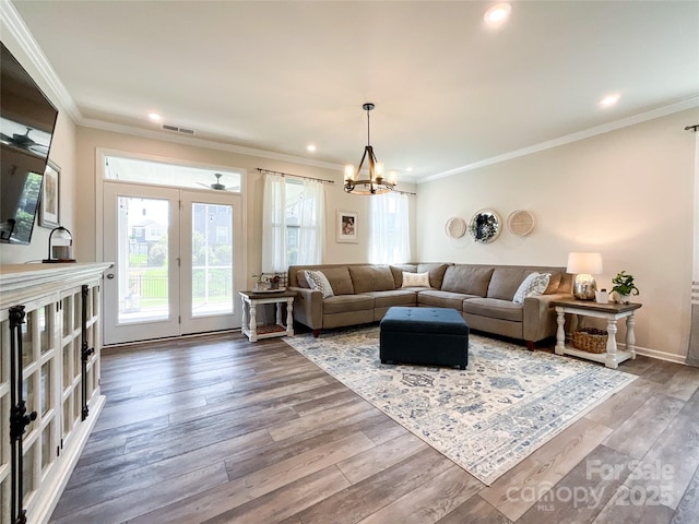 1024 Laggan Ln Unit 255, Indian Trail, NC 28079 - living room featuring ornamental molding, wood finished floors, recessed lighting, and a chandelier