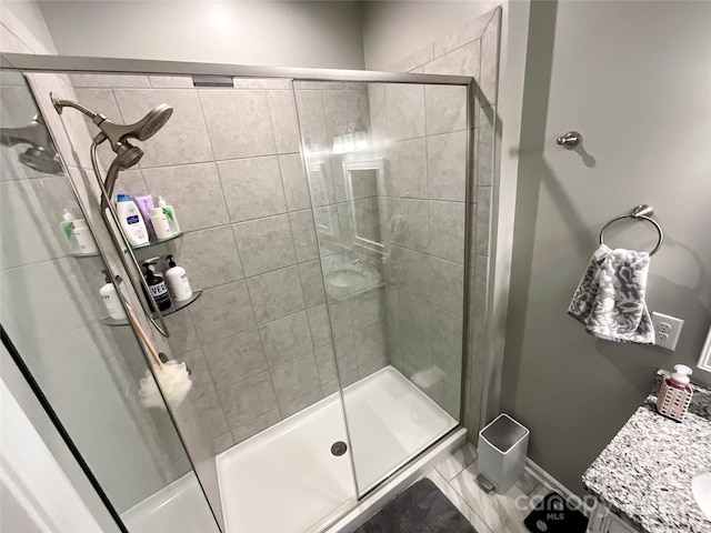 1024 Laggan Ln Unit 255, Indian Trail, NC 28079 - full bathroom featuring a shower stall, vanity, and tile patterned flooring