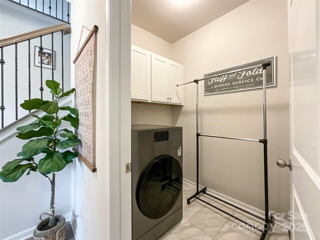 1024 Laggan Ln Unit 255, Indian Trail, NC 28079 - washroom featuring washer / clothes dryer, light marble finish flooring, and cabinet space