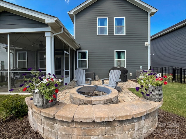 1024 Laggan Ln Unit 255, Indian Trail, NC 28079 - rear view of property with a sunroom, an outdoor fire pit, and a patio