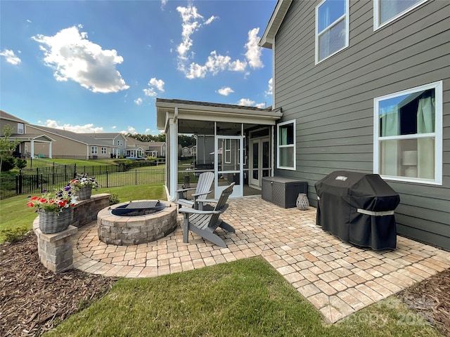 1024 Laggan Ln Unit 255, Indian Trail, NC 28079 - view of patio featuring a sunroom, an outdoor fire pit, a grill, and a residential view