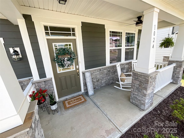 1024 Laggan Ln Unit 255, Indian Trail, NC 28079 - view of exterior entry with a porch, stone siding, and ceiling fan