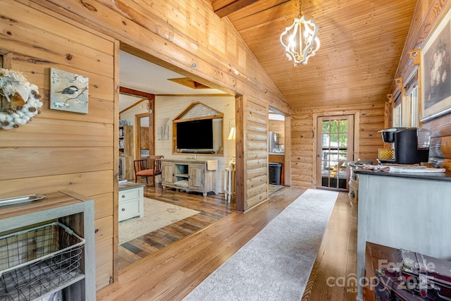 19 Timbers Edge Ln, Fairview, NC 28730 - kitchen featuring log walls, vaulted ceiling, hardwood / wood-style floors, a chandelier, and wood ceiling
