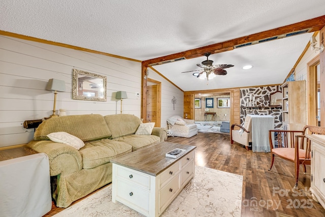 19 Timbers Edge Ln, Fairview, NC 28730 - living room featuring wood-type flooring, wooden walls, a ceiling fan, and a textured ceiling