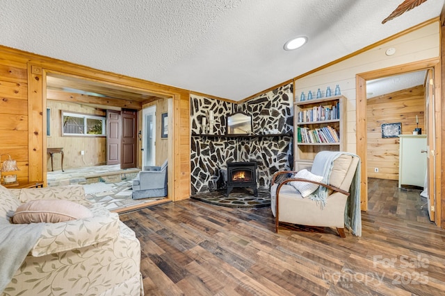 19 Timbers Edge Ln, Fairview, NC 28730 - living area with wood walls, a wood stove, a textured ceiling, wood finished floors, and lofted ceiling