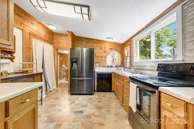19 Timbers Edge Ln, Fairview, NC 28730 - kitchen featuring stainless steel fridge, range with electric cooktop, dishwasher, wooden walls, and vaulted ceiling