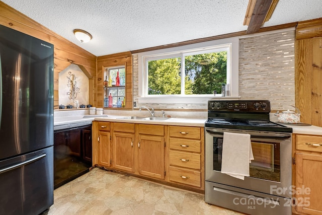 19 Timbers Edge Ln, Fairview, NC 28730 - kitchen with freestanding refrigerator, stainless steel range with electric stovetop, light countertops, a textured ceiling, and black dishwasher