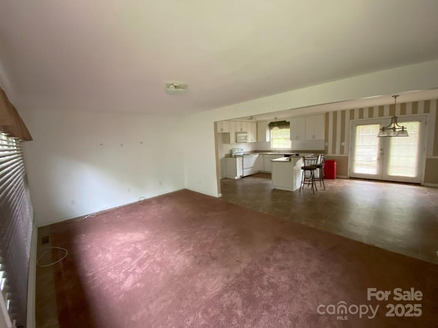 104 Edison St, Kings Mountain, NC 28086 - unfurnished living room with dark carpet